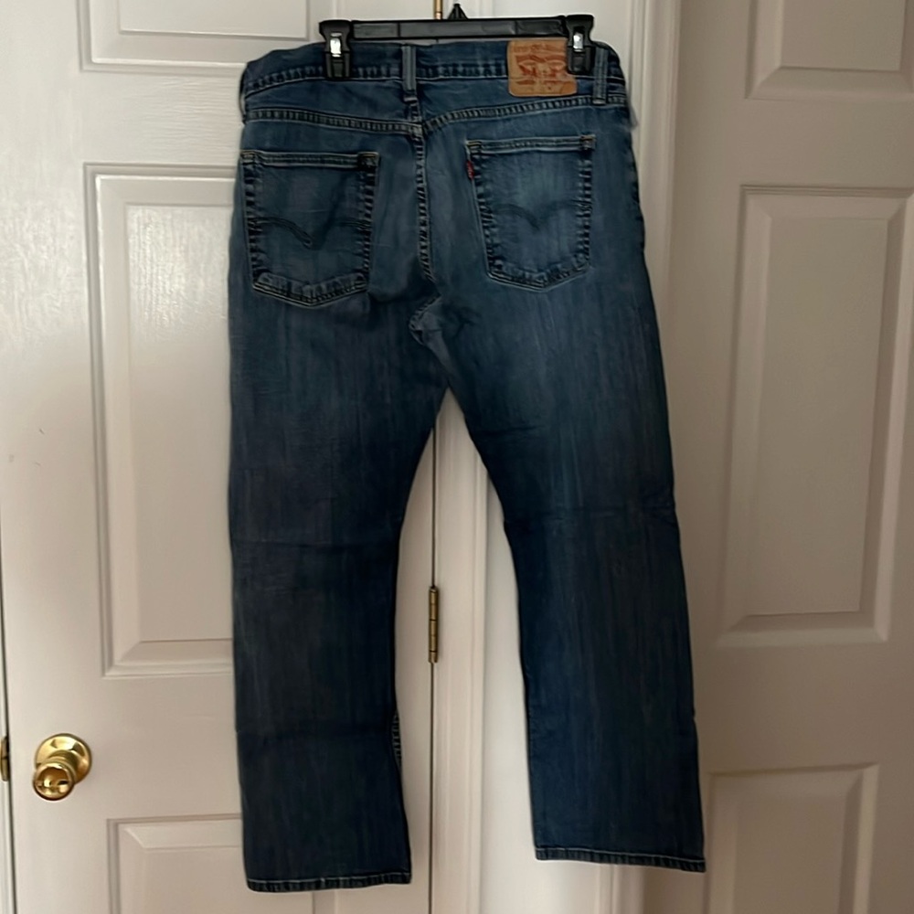 Worn Levi jeans.  36w 30l.  Small hole under the zipper